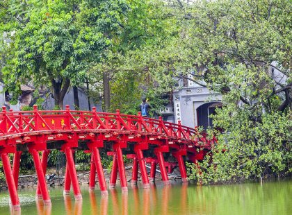 The famous red Huc Bridge over Hoan Kiem Lake in Hanoi, Vietnam.