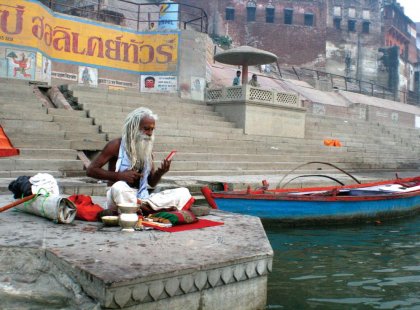 Sadhu, holyman, sitting on the banks of The Ganges in India