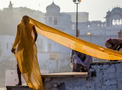 Local man with a long piece of cloth draped over him in Pushkar, India