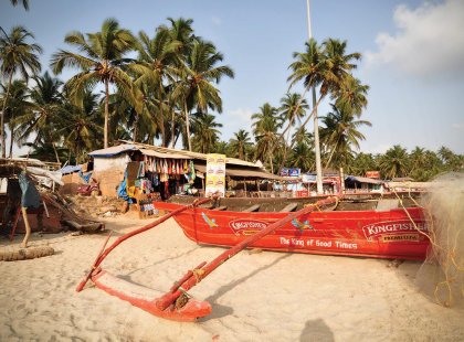 Red boat on Goa Beach in India