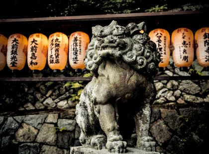 Statue in front of Laterns, Kyoto, Japan