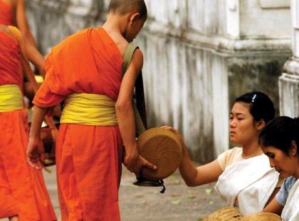 Alms giving in the streets of Laos