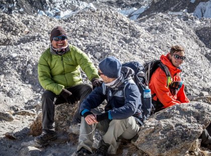 Everest base camp trek in Nepal. Leader and travellers enjoying a break