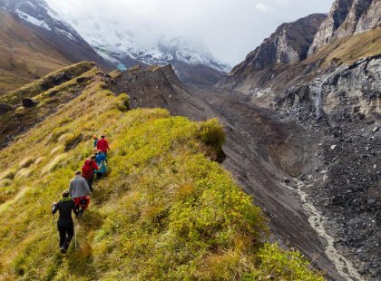 Travellers hiking towards the Annapurna Ranges on an Intrepid Travel tour in Nepal.