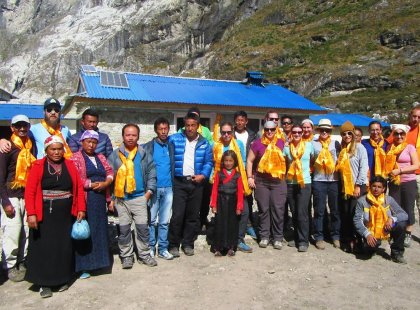A group of Intrepid travellers with locals in Langtang, Nepal