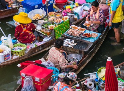 Visit the famous floating markets of Bangkok, Thailand