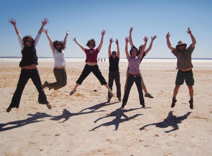 Tour group jumping at a salt lake in South Australia