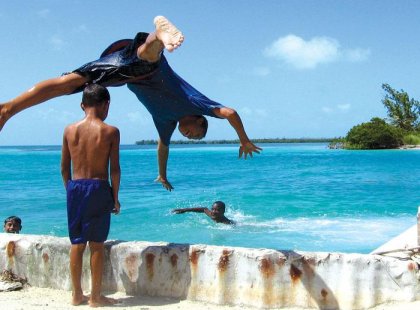 belize family swimming diving beach locals