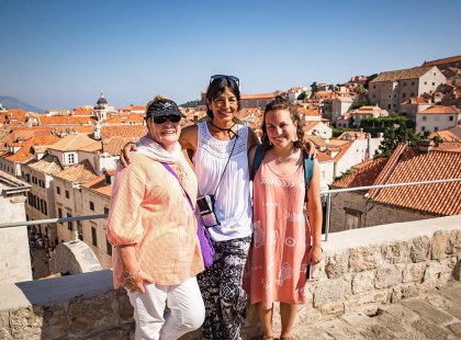 Intrepid travellers with view of Dubrovnik old town, Croatia
