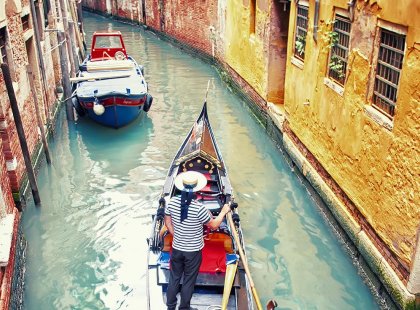 italy venice gondola with gondolier floating down canal