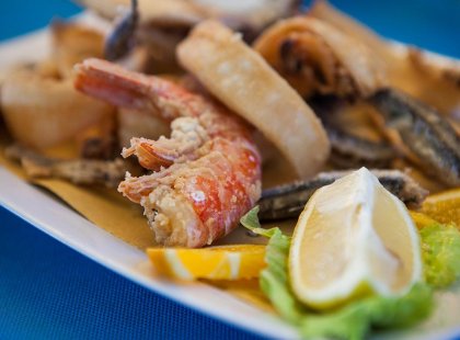 Try some of the delicious local seafood in Cinque Terre, Italy