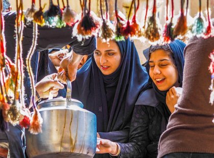 Two women at street food stall in Iran