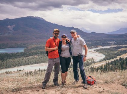 Travellers in among scenic mountainous landscape in Jasper, Canada on an Intrepid Travel tour.