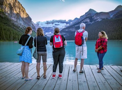 Travellers looking out upon Lake Louise in Banff, Canada on an Intrepid Travel tour.