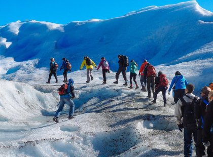 Group of travellers hiking up Perito Moreno Glacier in Argentina on an Intrepid Travel tour.