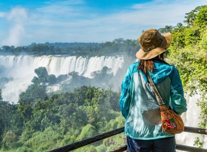 Traveller looking on at Iguazu Falls on an Intrepid Travel tour.