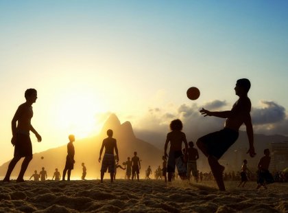 Playing football on Copacabana beach in Rio de Janeiro