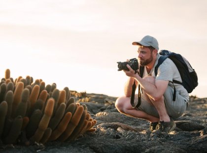 Traveller photographing flora on Galapagos Islands