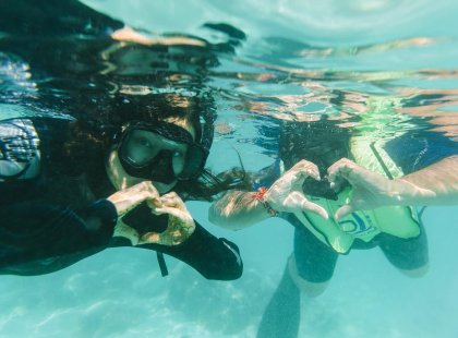 Travellers snorkelling in the Galapagos Islands