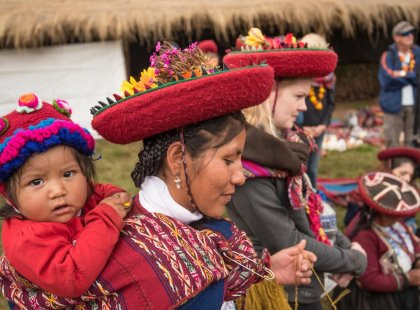 Local mother and child in traditional attire in Sacred Valley, Peru