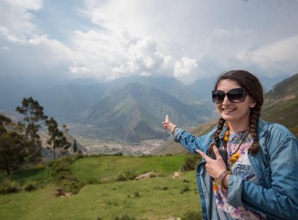 Traveller in front of scenic view of Sacred Valley on an Intrepid Travel tour
