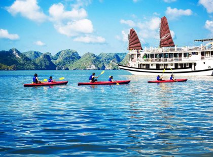 Explore a remote and stunning area of Halong Bay. In Bai Tu Long Bay, overnight on a private Vietnamese junk (ship) and swim and kayak its shimmering blue waters.
