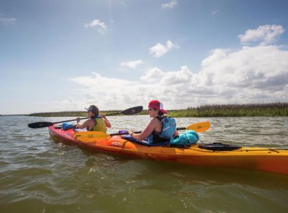 Feel the sun on your shoulders and the wind on your face while kayaking along the Carolina coast.