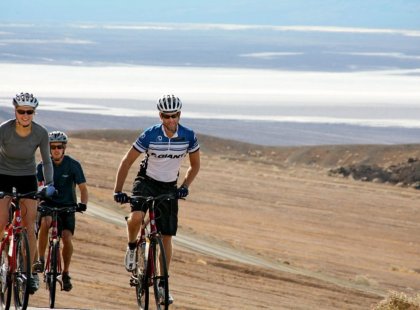 Join REI Adventures on a complete exploration of Death Valley National Park by bicycle a vast geological wonderland filled with soaring peaks, salt flats and sand dunes.